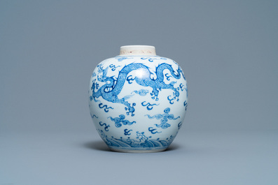A Chinese blue and white 'dragon and phoenix' jar with wooden lid, Chenghua mark, Kangxi