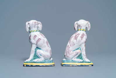 A pair of polychrome Dutch Delft money banks modelled as dogs, 18th C.