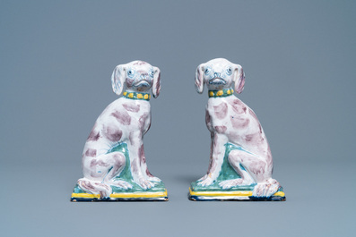 A pair of polychrome Dutch Delft money banks modelled as dogs, 18th C.