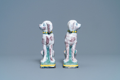 A pair of polychrome Dutch Delft money banks modelled as dogs, 18th C.