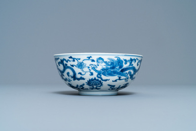 A Chinese blue and white 'dragon' bowl with a double vajra in the centre, Chenghua mark, Kangxi