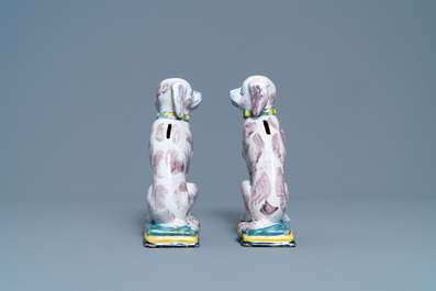 A pair of polychrome Dutch Delft money banks modelled as dogs, 18th C.