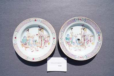 A pair of fine Chinese famille rose ruby back plates with figures in an interior, Yongzheng