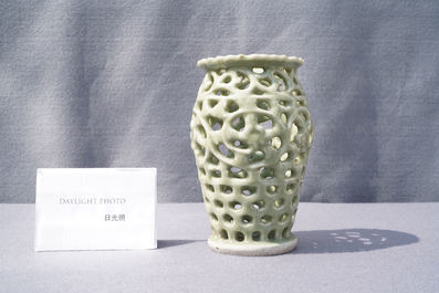 A Chinese reticulated monochrome Longquan celadon brush pot, Ming