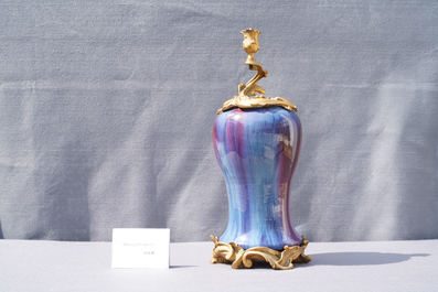 A Chinese flamb&eacute;-glazed vase with gilt bronze candelabra mount, 19th C.