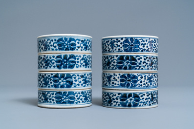 A pair of Chinese blue and white three-tier stacking boxes, a seal paste box and four saucers, 19th C.