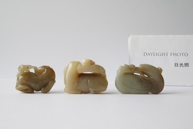 Five Chinese celadon and russet jade carvings, 19th C.