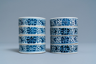 A pair of Chinese blue and white three-tier stacking boxes, a seal paste box and four saucers, 19th C.