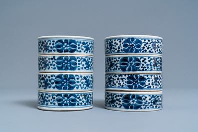 A pair of Chinese blue and white three-tier stacking boxes, a seal paste box and four saucers, 19th C.