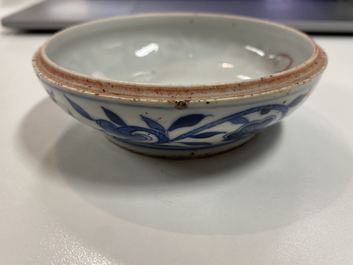 A pair of Chinese blue and white three-tier stacking boxes, a seal paste box and four saucers, 19th C.