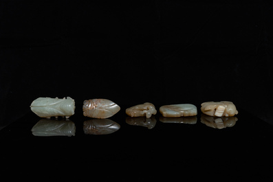 Five Chinese celadon and russet jade carvings, 19th C.