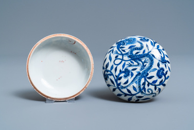 A pair of Chinese blue and white three-tier stacking boxes, a seal paste box and four saucers, 19th C.