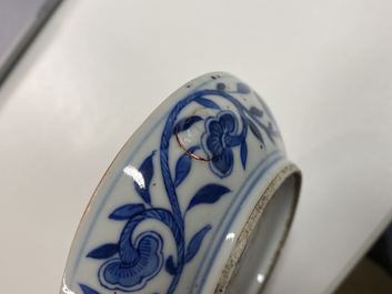 A pair of Chinese blue and white three-tier stacking boxes, a seal paste box and four saucers, 19th C.