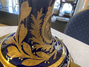 A pair of massive French S&egrave;vres-style vases with gilded bronze mounts, signed Desprez, 19th C.