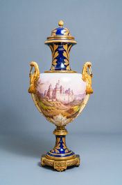 Une paire de tr&egrave;s grands vases en porcelaine dans le style de S&egrave;vres aux montures en bronze dor&eacute;, sign&eacute;s Desprez, France, 19&egrave;me