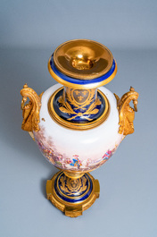 Une paire de tr&egrave;s grands vases en porcelaine dans le style de S&egrave;vres aux montures en bronze dor&eacute;, sign&eacute;s Desprez, France, 19&egrave;me