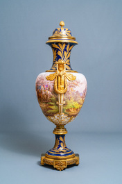 A pair of massive French S&egrave;vres-style vases with gilded bronze mounts, signed Desprez, 19th C.