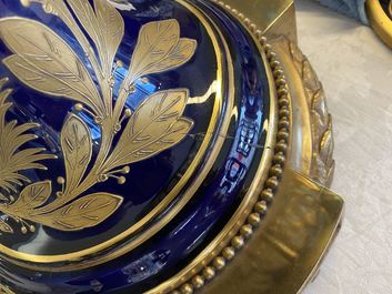 A pair of massive French S&egrave;vres-style vases with gilded bronze mounts, signed Desprez, 19th C.