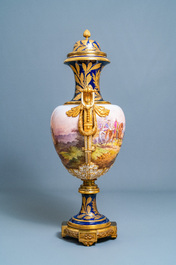 A pair of massive French S&egrave;vres-style vases with gilded bronze mounts, signed Desprez, 19th C.