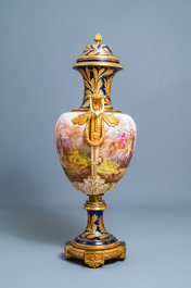 A pair of massive French S&egrave;vres-style vases with gilded bronze mounts, signed Desprez, 19th C.