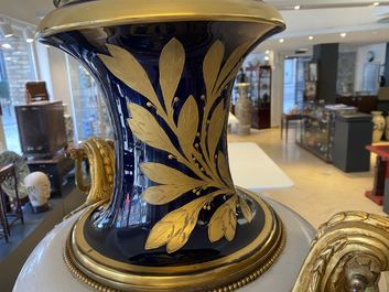 A pair of massive French S&egrave;vres-style vases with gilded bronze mounts, signed Desprez, 19th C.