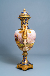 A pair of massive French S&egrave;vres-style vases with gilded bronze mounts, signed Desprez, 19th C.