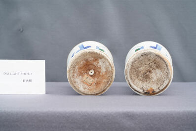 A pair of Chinese wucai 'gu' vases, 19th C.