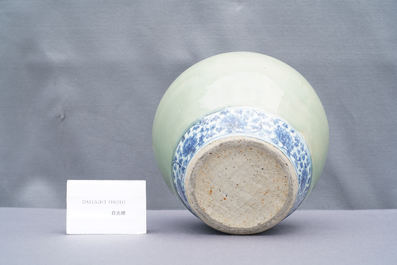 A Chinese celadon-ground and blue and white 'lotus scroll' jar, Ming