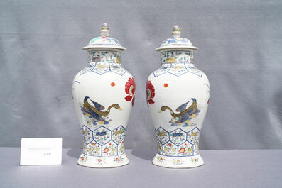A pair of Chinese famille rose 'mandarin ducks' vases and covers, Kangxi mark, Republic