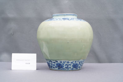 A Chinese celadon-ground and blue and white 'lotus scroll' jar, Ming