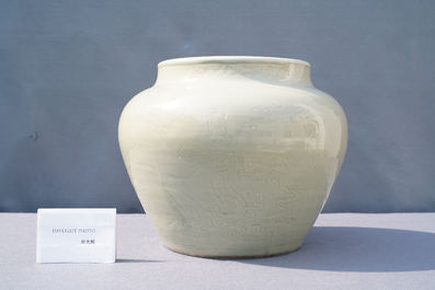 A globular Chinese monochrome celadon 'dragon' vase, Kangxi