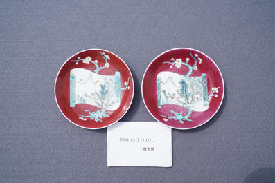 A pair of Chinese famille rose ruby-ground cups and saucers, Yongzheng