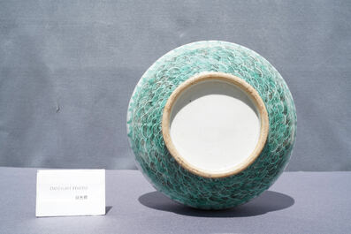 A Chinese white-glazed garlic head vase with an applied dragon, 19th C.