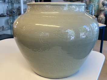 A globular Chinese monochrome celadon 'dragon' vase, Kangxi