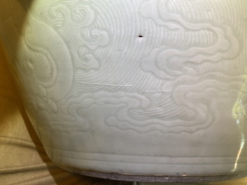 A globular Chinese monochrome celadon 'dragon' vase, Kangxi