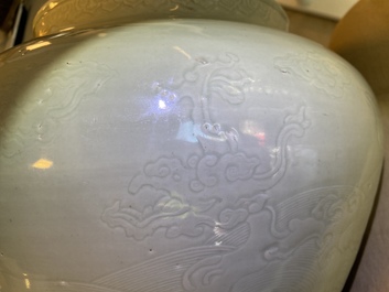 A globular Chinese monochrome celadon 'dragon' vase, Kangxi