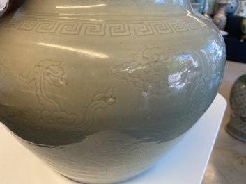 A globular Chinese monochrome celadon 'dragon' vase, Kangxi