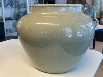 A globular Chinese monochrome celadon 'dragon' vase, Kangxi