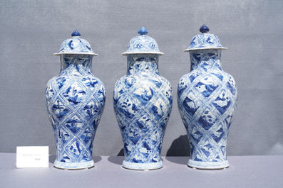 A large Chinese blue and white five-piece garniture with floral and landscape panels, Kangxi
