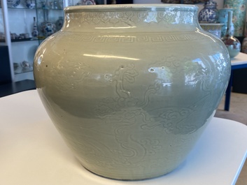 A globular Chinese monochrome celadon 'dragon' vase, Kangxi