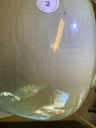 A globular Chinese monochrome celadon 'dragon' vase, Kangxi