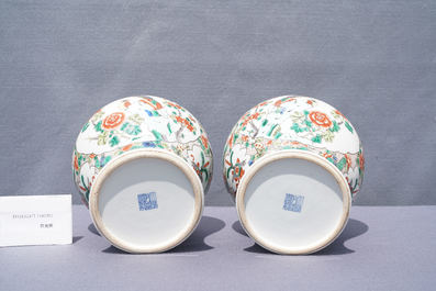 Two pairs of Chinese blue and white and famille verte vases and covers, 19/20th C.