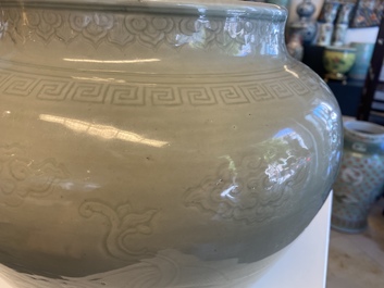 A globular Chinese monochrome celadon 'dragon' vase, Kangxi