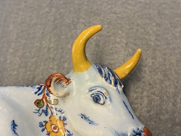 A polychrome Dutch Delft butter tub in the shape of a cow, 18th C.