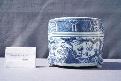A Chinese blue and white 'dragon' tripod censer, Ming