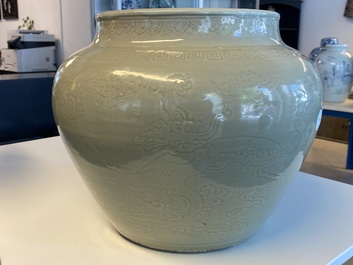 A globular Chinese monochrome celadon 'dragon' vase, Kangxi