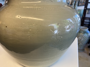 A globular Chinese monochrome celadon 'dragon' vase, Kangxi