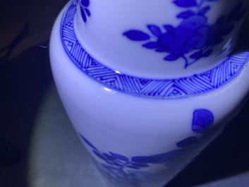 A Chinese blue and white rouleau vase with floral design, Kangxi