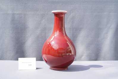 A Chinese monochrome langyao-glazed bottle vase, marked 'Made in Jingdezhen in 1955'