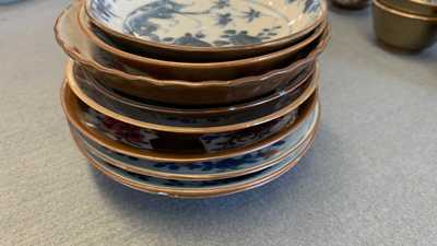 31 Chinese capucine brown-ground saucers and 22 cups, Kangxi/Qianlong